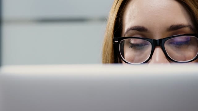 Woman Behind Laptop